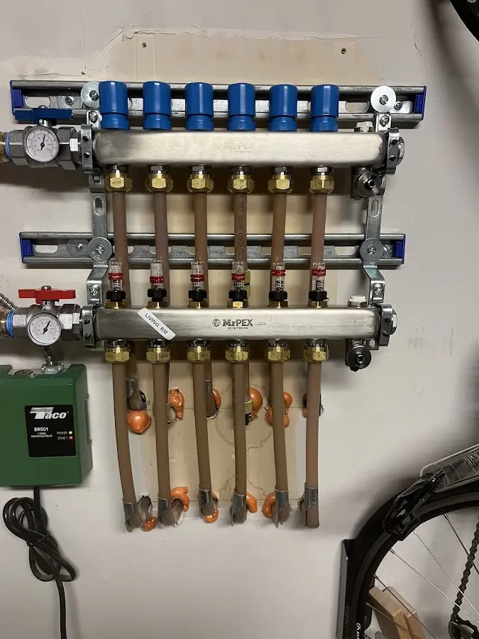 Plumber performing Water Heater Repair at a residential property in West Falls Church